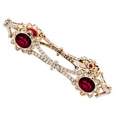 18KT White & Yellow Gold Rubelite & Diamond bracelet with floral motif. This gorgeous piece is adorned with 4 Oval Cut Rubellite for a total approximate weight of 10.00 carats and 148 Round Cut Diamonds for a total approximate diamond weight of 2.12 carats. The bracelet measures 7.25 inches long and weighs 25.8 grams. Jewelry Necklace Simple, Expensive Jewelry Luxury, Floral Bracelet, White Gold Bracelet, Rose Jewelry, Pretty Bracelets, Fine Jewelry Bracelets, Yellow Gold Bracelet, Play Dress