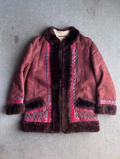 Beautiful 1960s / 1970s Embroidered shearling coat. Good vintage condition. Clasps in the front for closure.  21" Pit to pit  30" Length  18" Shoulder  21" Outer Sleeve All sales final. please ask any questions you have before buying - Thanks! Retro Embroidered Winter Outerwear, Vintage Brown Embroidered Outerwear, Vintage Embroidered Winter Outerwear, 1960s Jacket, Fall Winter Jacket, 60s Mod, Penny Lane, Shearling Coat, Stevie Nicks