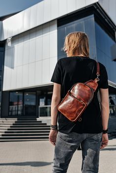 Item description. What would you call it at a first sight, a bag or a backpack? It's at once a bag, a backpack and something in between! Relatively small in size, but very spacious and practical. Zip-fasteners make it look more modern and dynamical. Zip pocket on the front wall : 8.3 x 6.7 in / 21 x 17 cm Inside pocket on the back wall : 6.7x5.5 in / 17 x 14 cm Adjustable Strap 43.3 in / 110 cm. It is fixed on carbines which can be fastened to the left or right side Size : 12.2 x 8.7 x 2 in 31 x Casual Soft Leather Bag For Everyday, Casual Soft Leather Bag For Everyday Carry, Casual Everyday Carry Bag In Soft Leather, Casual Brown Satchel For Everyday Use, Brown Satchel Chest Bag For School, Brown Leather Satchel Chest Bag, Brown Leather Backpack With Adjustable Strap For Everyday, Brown Waxed Finish Shoulder Backpack, Brown Waxed Finish Backpack Shoulder Bag