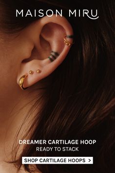 a woman with ear piercings on her ears and the words dream cartilage hoop ready to stack shop cartilage hoops