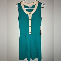 Vintage Nwt St John Sportswear Jade Sleeveless Sweater Dress Size 10 Wool Blend. (There Is A Small Hole On Front- See Photos. Repairable) New With Tags Vintage St. John Dry Clean Only Rayon Wool Blend Knee Length Jade/White 7665 Button Closure Stretch Pleated Gold/Jade Buttons Made In Usa More Than 100 Pieces Of Vintage St. John Separates And Sets Coming To My Store In Coming Weeks And Months. Some New With Tags. Continue To Visit For Amazing Pieces! Green Fitted Sleeveless Tennis Dress, Sleeveless Green Tennis Dress For Spring, Fitted Green Sleeveless Tennis Dress, White Sleeveless Tennis Dress, Sleeveless Tennis Dress, Casual Sleeveless Summer Tennis Dress, Casual Sleeveless Tennis Dress For Summer, Sporty Green Sleeveless Tennis Dress, Casual Green Tennis Dress For Spring