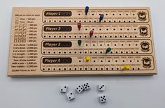 a wooden board with dices and numbers on it