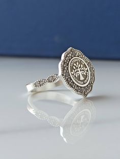 This product is GUARANTEED for life. * College graduation rings for men and women delicately engraved with your school logo or any other initials or image you want. * The ring has solid back. Deep and detailed engraving very delicately handcrafted unisex - looks super cool on both women & men * The ring is 925 Silver * Please contact me for your 14 carat and 18 carat solid gold requests. I can gladly do. * Certified 14k solid gold, hallmarked 14k for solid gold rings. * The ring has solid ba Spiritual Silver Signet Ring For Wedding, Symbolic Sterling Silver Rings For Anniversary, Spiritual Sterling Silver Signet Ring For Gift, Spiritual White Gold Engraved Ring For Gift, Spiritual White Gold Engraved Ring Gift, Spiritual Sterling Silver Engraved Ring Gift, Engraved Sterling Silver Stackable Rings, Spiritual Sterling Silver Signet Ring For Anniversary, Spiritual Sterling Silver Engraved Ring For Anniversary