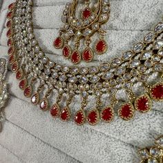 Beautifully flexible Antique Gold intricate necklace set scattered with dazzling clear zircon crystals and red drops. Comes with matching earrings (approx 2.5 inch length x 1.5 inch width) and matching tikka ( pendant part 2 inch length x 1.5 inch width)  Ready to ship as seen with gift box! Intricate Necklace, Kundan Set, Small Necklace, Pierced Jewelry, Matching Earrings, Antique Gold, Necklace Set, Sell On Etsy, Etsy Accessories