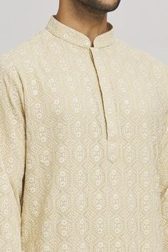 Beige cotton kurta with sequins and thread embroidery. Comes with churidar. - Aza Fashions Eid Cotton Sets With Motifs, Cotton Sets With Motifs For Eid, Cotton Traditional Wear With Printed Motifs For Wedding, Cotton Kurta With Printed Motifs For Wedding, Wedding Cotton Salwar Kameez With Printed Motifs, Semi-stitched Straight Kurta With Motifs, Festive Printed Motifs Kurta For Wedding, Transitional Cotton Salwar Kameez With Zari Work, Long Sleeve Cotton Silk Kurta With Intricate Embroidery