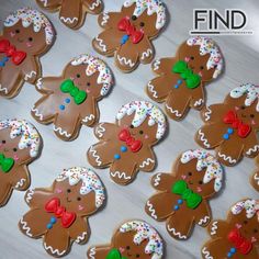 many decorated ginger cookies on a table