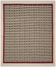 a beige and red area rug with wavy lines