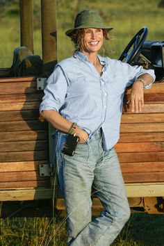 a man standing in front of a wooden truck