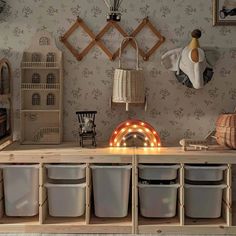 a room with several storage bins and various items on the shelves in front of it