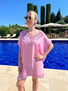 This beach worthy pink coverup has beautiful on-trend crochet detailing. Cut straight from bust to hem and perfect to throw over your favourite swimwear on the beach or from pool to bar. Cool to wear made in a crinkle viscose crepe with cotton crochet trim on all sides and stunning feature neckline. SIZE AND FIT INFORMATION One Size: Fits UK 12-18 (U.S 8-14) Bust/Hip  59 inches (150cm) Length 35 inches (90 cm) CARE INSTRUCTIONS 100% Viscose Trim 100% Cotton Hand wash separately in cold water wit Ruana Pattern, Crochet Coverup, Long Caftan Dress, Moroccan Print, Beach Crochet, Bohemian Tunics, Poolside Fashion, Crochet Cover Up, Pink Crochet