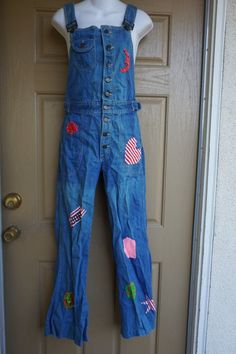 Vintage 70s Hang Ten denim overalls. Upcycled with patches. RARE! Good vintage condition.  measurements taken across front lying flatwaist 14.5" at waistbandinseam 30"19" hip Retro Denim Bib Front Jumpsuit, Retro Denim Jumpsuit With Bib Front, Retro Medium Wash Cotton Denim Jumpsuit, Retro Cotton Denim Jumpsuit In Medium Wash, Retro Bib Front Denim Jumpsuit, Retro Cotton Denim Jumpsuit With Bib Front, Retro Cotton Jeans With Bib Front, Retro Bib Front Cotton Jeans, Retro Medium Wash Cotton Overalls