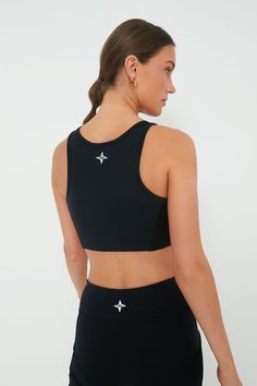 The Black Cane Jean Sports Bra is your ideal athletic bra- featuring heavy weight compression and quick dry properties, you are sure to be comfortable and secure for day-long activities. Scoop neck Reflective logo on back Power mesh interior Compression support Quick dry and wicking properties Material: 88% Nylon, 12% Spandex (main), 82% Nylon, 18% Spandex (mesh interior) Care: Gentle machine wash on cold, line dry Compressive Sports Bra With Mesh Back For Gym, Compressive Mesh Back Sports Bra For Gym, Compressive Go-dry Activewear For Sports Events, Functional Compressive Activewear With Mesh Back, Functional Compression Sports Bra With Moisture-wicking, Compressive Nylon Sports Bra For Sports Events, Functional Compressive Sports Bra With Mesh Back, Functional Compressive Moisture-wicking Sports Bra, Black Go-dry Nylon Sports Bra