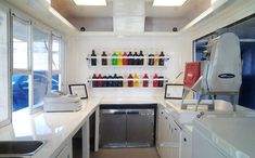 a kitchen with lots of bottles on the wall