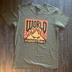 World Industries T-Shirt Brand New Comes With Tags Rare Find ! #Worldindustries #Retro #Vintage #90s #Depopfamous 90s Cotton T-shirt With Front Print, Retro Green T-shirt For Streetwear, Crew Neck Cotton Top For Urban Adventures, Cotton Crew Neck Top For Urban Adventures, 90s Style Cotton T-shirt With Front Print, Retro Cotton T-shirt With Logo Print, Retro Orange Crew Neck T-shirt, Green Retro T-shirt For Streetwear, Graphic Cotton Tee For Urban Adventures