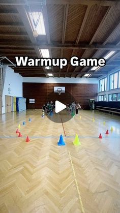 an image of a room with many cones on the floor and people in the background