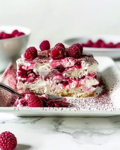 a piece of raspberry cheesecake on a plate