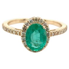 Oval cut Emerald gemstone beautifully crafted in a 10K yellow gold ring with natural diamonds. With a vibrant green color hue. The birthstone for May is a symbol of renewed spring growth. Explore a vast range of precious stone Jewelry in our store. Centre stone is an oval shape emerald with 1.10 carat weight & approx measurement - 8.00X6.00X3.80 mm. Diamond enhancing the beauty of ring weighs 0.27 cts. Explore more variety of Sapphires, Emeralds & Rubies in our store available as a loose gemstone that can be made & customize into this particular design or a bespoke jewelry piece of your choice. Heirloom Oval Emerald Ring Gia Certified, Heirloom Oval Gia Certified Emerald Ring, Gia Certified Oval Green Diamond Ring, Oval Yellow Gold Halo Ring Gia Certified, Oval Emerald Ring With Halo Design, Green Oval Diamond Ring Fine Jewelry, Gia Certified Oval Emerald Cluster Ring, Oval Emerald Ring In Yellow Gold With Prong Setting, Oval Emerald Ring In Yellow Gold With Halo Setting