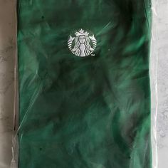 a starbucks bag sitting on top of a counter