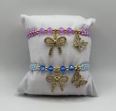 Our Butterfly and Bow Charm Bracelet makes the perfect gift for friends and family. The bracelet is adjustable and fits most wrists but can be made smaller or larger upon request. Due to the nature of the jewelry, avoid getting it wet or exposing it to lotions, perfumes, etc to ensure a long-lasting bracelet and prevent tarnishing. If you have any questions, please message us. Thank you for supporting our small business! Adjustable Purple Bracelet Gift, Adjustable Purple Bracelet For Gift, Adjustable Purple Bracelets For Gifts, Adjustable Purple Bracelets As A Gift, Adjustable Jubilee Charm Bracelet For Friendship, Adjustable Crystal Bangle Bracelet For Friendship, Adjustable Jubilee Stretch Bracelet As Gift, Adjustable Hypoallergenic Bracelets As Gift, Adjustable Hypoallergenic Bracelet As Gift