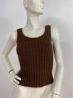 "Brown knit tank, knit tank top, fits like a women's size small, please verify exact measurements below Measurements:  Shoulder (outer seam-seam)11\"/bust(pit-pit)13\"(stretches several inches)bottom width 12\"-20\"/length 19\" Mannequin measurements:  5'8\", bust 34\", waist 25\", hip 33\" Please note that vintage clothing sizes can vary greatly.  The Measurements provided  are approximate and are taken lying flat.  I suggest taking a similar garment from your wardrobe and measure it while lying flat.  This way you can compare measurements.   Don't forget to enlarge the photos and take a closer look at this genuine vintage item!! I will ship your item off within 1-2 business days. I ship expedited for all Canadian and US orders. All other destinations world wide will be shipped surface an Knit Tank Top, Knit Tank, Knitted Tank Top, Knit Tanks, Womens Tank, Vintage Clothing, Womens Clothing Tops, Dream Closet, Tank Tops Women