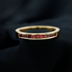 Product Details Go trendy with this Simple Stackable Ring set with sparkling Princess Cut Garnet gemstones. This Stackable Band is crafted with Solid Gold to make for an opulent choice for your everyday style. Product Information SKU SHP-RINGS042162837 Width 1.5 mm Height 2.5 mm Weight 2.48 gm (Approximate) GARNET INFORMATION No.of Stones 11 Pieces Total Weight 0.74 Carat (Approximate) Dimension(approx) Princess Cut-2X2 mm-11 Pcs Color Red Cut Brilliant Shape Princess Cut Setting Type Channel Setting Quality Grade AAA View More Product Parent Collection Handle garnet-men-wedding-bands Luxury Ruby Jewelry Channel Set, Luxury Ruby Channel Set Jewelry, Luxury Channel Set Ruby Jewelry, Luxury Ruby Ring Channel Set For Anniversary, Formal Multi-stone Cubic Zirconia Birthstone Ring, Elegant Ruby Jewelry Channel Set, Ruby Ring With Channel Set Diamonds In Yellow Gold, Formal Multi-stone Ruby Ring In Cubic Zirconia, Luxury Ruby Half Eternity Ring For Anniversary