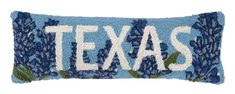 a blue pillow with the word texas on it