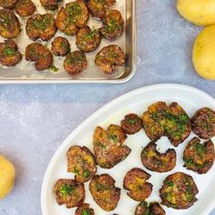 some food is sitting on a plate and next to two trays of lemons