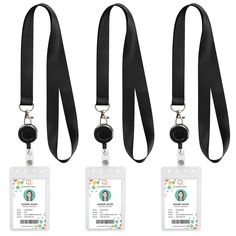 three lanyards with id cards attached to them, one is black and the other is white