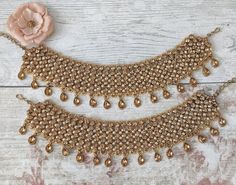 "Beautiful pair of Indian Asian Bollywood style anklets traditionally called payals or jhanjara.  Gold base filled with intricate silver Kundan stones & detailed pearls.  Designed to worn lower on the foot rather than the ankle - so they do hang low depending on foot/ankle size. One size: Usually fits all unless you wear anklets smaller than 10\"." Wedding Anklets With Stone Work, Wedding Stone Work Anklets, Elegant Stone Work Anklets For Wedding, Festive Meenakari Anklets For Wedding, Traditional Tilla Anklets For Weddings, Traditional Wedding Anklets With Stone Work, Traditional Wedding Anklets For Festivals, Traditional Festive Anklets With Stone Work, Festive Traditional Anklets With Stone Work