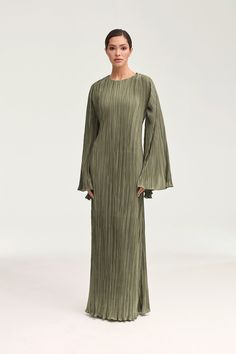 Indulge in effortless elegance with our Camille Satin Plisse Maxi Dress in Chocolate Brown. The luxurious satin plisse material elevates this maxi dress, while the tie waist detailing and dramatic bell sleeves add a touch of sophistication. Perfect for any occasion, this dress exudes luxurious and exclusive style. Model is 5'7" and is wearing size XS/58". Elegant Fashion Outfits, Plisse Dress, White Dress Formal, Nikkah Dress, Muslim Fashion Outfits, Basic Dress, Hijab Dress, Ribbed Dresses, Islamic Fashion