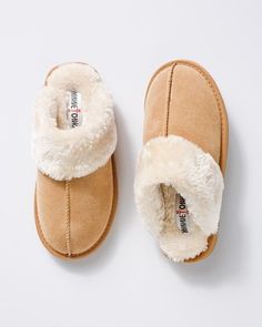 These cushy, comfy backless Minnetonka slippers were made for lounging on a cozy day. Details Slip-on. Suede outer fabric. Warm plush lining and scruff. Thick rubber soles for indoor and outdoor wear. Outer: 100% suede. Lining: 100% polyester. Spot clean as needed. Imported. Online Exclusive. By Minnetonka. Minnetonka Slippers, Cozy Day, Bridal Shower Inspiration, Comfy Slippers, The Vanishing, Hype Shoes, Cute House, Slippers Cozy, Shoe Closet