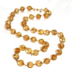 "This necklace will make a citrine lover swoon! Large transparent citrine beads are hand wire wrapped with gold vermeil. This necklace measures approximately 16\" and closes with a gold vermeil hook and eye clasp. Beautiful! xoxoxo payton For more cool jewelry looks, check out http://www.etsy.com/shop/FizzCandy All FizzCandy creations come beautifully boxed and ready for gift giving. Looking for a beautiful gift? Our handcrafted gemstone jewelry is one of a kind. Our jewelry is perfect for: ○ Mo Luxury Citrine Necklace With Polished Finish, Luxury Polished Citrine Necklace, Luxury Orange Citrine Necklace, Luxury Gold Citrine Necklace, Gold Faceted Bead Crystal Necklace, Citrine Necklace With Natural Stones, Citrine Necklace With Natural Stones In Round Shape, Elegant Citrine Gemstone Beads Necklace, Elegant Citrine Gemstone Bead Necklaces