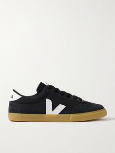 Veja's 'Volley' sneakers take cues from popular styles from the '70s. Made from canvas, they're trimmed with smooth suede and leather and feature the iconic 'V' logos at the center. The padded collars and tongue ensure a comfortable fit. Veja Volley, Veja Shoes, Veja Sneakers, Popular Styles, Canvas Sneakers, Black Canvas, Popular Style, Sneakers Black, Leather And Lace