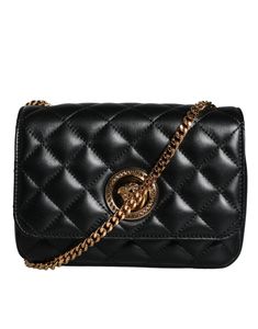 The Versace Black Quilted Lambskin Leather Crossbody Shoulder Bag sports a solid color and features the iconic Versace brand logo in the form of engraved metal hardware. The adjustable shoulder strap, measuring at 110cm, provides versatile styling options for any occasion.   Model: Crossbody bag   Color: Black   Fabric inner lining with inside pocket   Handle: Adjustable shoulder strap   Logo engraved metal hardware   Made in Italy   Measurements: 19cm x 13cm x 7cm   Strap: 110cm Versace Brand, Engraved Metal, Versace Bags, Messenger Bag Backpack, Metal Engraving, Black Quilt, Quilted Leather, Leather Chain, Metal Hardware