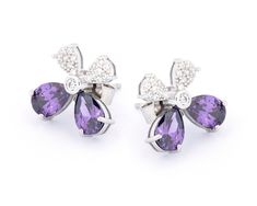 These dainty amethyst cubic zirconia stud earrings are elegantly crafted in silver rhodium plating on the highest quality 925 sterling silver, perfect for wearing every day or for a special occasion. The essential design and precise craftsmanship create a special piece that will delight any jewelry lover.  ~ DESIGN ~ Metal: Silver Rhodium Plating on Sterling Silver Stone: Amethyst Cubic Zirconia and White Cubic Zirconias Measures: 13mm x 12mm Weight: 4gr Anti-Allergy Material: Nickel-free, lead- Purple Cubic Zirconia Earrings, Purple Cubic Zirconia Earrings With Sparkling Stones, Purple Diamond Earrings For Gift, Purple Cubic Zirconia Earrings For Anniversary, Flower Earrings Silver, Stud Earrings Silver, Silver Flower Earrings, Mother Of Pearl Earrings, Silver Stud Earrings