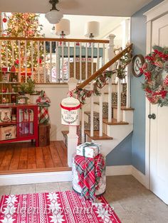 christmas decorations and presents are on display in the entryway