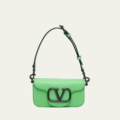 Valentino Garavani "Mini Locò" shoulder bag in leather  VLogo hardware on the front Adjustable detachable crossbody strap; 21.6"L Adjustable detachable carry handle; 4.7" drop Flap top with magnetic fastening Interior, one slip pocket Approx. 3.9"H x 7.9"W x 0.39"D Made in Italy