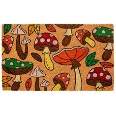 a door mat with mushrooms and leaves on it