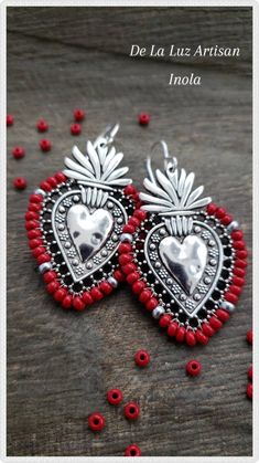 Inola - Red Beaded Silver Sacred Heart Earrings Dangle Latina Lace Love Latinx Fiesta Flaming Hearts Metal Heart Earrings With Heart Beads, Bohemian Beaded Jewelry For Valentine's Day, Silver Heart-shaped Jewelry For Festival, Valentine's Day Bohemian Beaded Jewelry, Heart-shaped Pierced Earrings For Festivals, Handmade Red Heart-shaped Jewelry, Red Heart Beads Dangle Earrings, Valentine's Day Festival Metal Jewelry, Bohemian Handmade Sterling Silver Heart Earrings