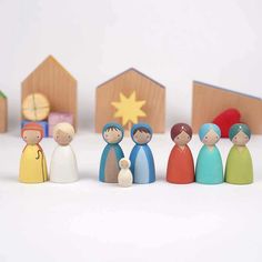 a group of small wooden figurines sitting next to each other