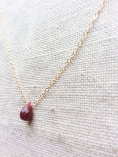 This is a ruby necklace made of genuine high quality faceted ruby and gold filled chain. This gold ruby necklace is July birthstone. Rudy is Dainty Ruby Gemstone Necklace, Ruby Birthstone Necklaces, Ruby Briolette Gemstone Jewelry, Red Ruby Birthstone Necklace, Red Ruby Gemstone Birthstone Necklace, Yellow Gold Ruby Teardrop Necklace, Teardrop Ruby Necklace In Yellow Gold, Yellow Gold Teardrop Ruby Necklace, Ruby Gemstone Teardrop Pendant Necklace