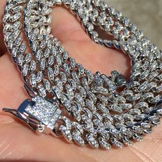 Shine bright like a diamond with this Mens Real 925 Sterling Silver Iced Cuban Hip Hop Chain Bling Out CZ. Handmade in Italy with Micro Pave Setting Style, this 6MM thick chain is perfect for all hip-hop lovers. Get yours now in 16"-24" length. #HipHopJewelry #Necklaces #CubanChain #HipHopChains #SilverChain #MensNecklace # 🤩💎🔥 Silver Cuban Link Necklace With Rhinestones, Silver Rhinestone Cuban Link Necklace, Silver Cuban Link Jewelry With Rhinestones, White Gold Cuban Link Necklace With Rhinestones, Silver Cuban Link Bling Necklace, Sterling Silver Cuban Link Necklace With Bling, Silver Cuban Link Chain Necklace With Rhinestones, Silver Diamond Cuban Link Necklace With Bling, Diamond Cuban Link Necklace In Silver