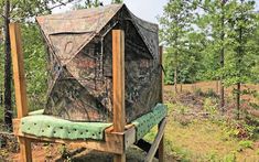 a tree stand with a camouflage cover on it