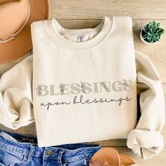 Blessings Upon Blessings Christian sweatshirt, Jesus over everything, Bible verse shirt, religious shirt, faith over fear, boho Christian, floral For more products https://harmonyandhomedesign.etsy.com/ How - To - Order - Select Your Shirt Style  - Select Your Shirt Color - Select Your Quantity - Add Item to Your Cart -Proceed to checkout  -- If you will have more than one shirt you can add them to your cart one by one so you can have one order. RETURN POLICY  -Our shirts are made to order speci Jesus Over Everything, Boho Christian, Bible Verse Shirt, Religious Shirt, Christian Sweatshirt, Faith Over Fear, Versatile Outfits, Cut And Style, Classic Looks