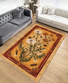 a living room with two couches and a rug on the floor that has flowers painted on it