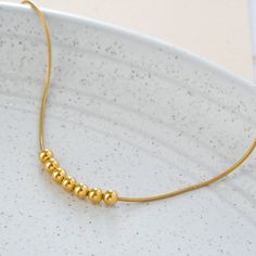 "Hello, we handcraft all of our jewelry ourselves and we will ship fast. We design long lasting pieces for your everyday apparel. This necklace is part of the minimalism collection. you or your loved one can look beautiful with this necklace. * Beads and chain Material: Vermeil Gold (24k Gold over Solid Sterling Silver) * Beads Diameter: 4 mm or 0.16\" Approximately * Length of Chain: Choose the length * Ready to Ship in 2 business days * Made in the USA Keep all your jewelry in an enclosed and