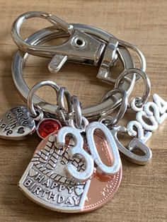 a close up of a key chain on a table