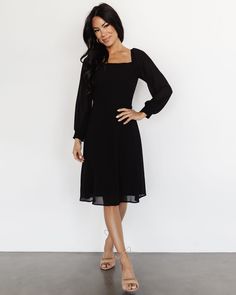 From the square neck to the wrist-hugging sleeves, the Elise Short Dress | Black effortlessly blends sophistication and comfort 🖤✨ Hurry, it's a wardrobe favorite for a reason! Shop this beauty! 🛍️ Chic Midi Dress With Smocked Back, Elegant Fitted Smocked Dress With Ruched Detail, Elegant Fitted Ruched Smocked Dress, Elegant Fitted Smocked Ruched Dress, Square Neck Dress With Smocked Back For Date Night, Flowy Midi Dress With Smocked Back For Party, Flowy Party Midi Dress With Smocked Back, Chic Fitted Smocked Dress For Party, Chic Fitted Smocked Party Dress