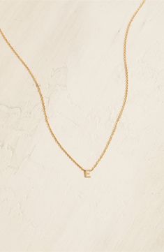 Personalize your stack with this layering-friendly necklace centered with a dainty pendant of your favorite initial filled with 14-karat yellow gold. 16" length 14k-gold fill Made in the USA Tiny Gold Initial Necklace For Everyday, Everyday Tiny Gold Initial Necklace, Dainty 14k Gold Filled Initial Necklace For Everyday, Everyday Yellow Gold Initial Necklace With Delicate Chain, Dainty Initial Pendant Necklace For Layering, Everyday 14k Gold Filled Initial Pendant Necklace, Everyday 14k Gold-filled Initial Necklace, Everyday 14k Gold Filled Initial Necklace, Everyday Yellow Gold Initial Necklace