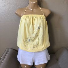 Beautiful Yellow Tie Halter Top Silver Foil Flowers Strapless Blouson Style Hidden Kangaroo Pocket Pouch In Front Perfect For Spring/Summer Bundle To Save Send Your Offers Yellow Halter Top For Spring Vacation, Yellow Stretch Halter Neck Top, Yellow Halter Neck Tank Top For Summer, Fitted Yellow Tank Top For Beach Season, Yellow Tank Top For Spring Vacation, Yellow Tank Top For Vacation And Spring, Yellow Tank Top For Vacation In Spring, Yellow Halter Neck Top For Beach, Yellow Halter Neck Tops For The Beach